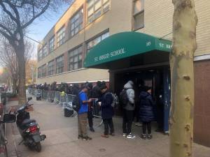 The asylum seekers check-in center at the former St. Brigid School on E. 7th St. is the only reticketing center in the five boroughs. Several council members are urging Mayor Adams to alleviate the crunch and open up new centers. Photo: Keith J. Kelly