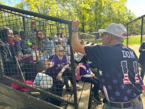 <b>Team USA coach Don Landolphi, author of two baseball books and a former teacher and Hall of Fame baseball coach at Brooklyn College, gives the sight challenged and blind youths a pep talk before leading them onto the field.</b> Photo: Lighthouse Guild