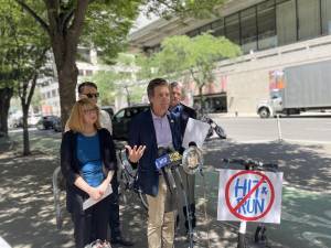 State Senator Brad Hoylman (at mic) speaks 64th Street and Amsterdam Ave., where actor Lisa Banes died. Photo: Aaron Ghitelman