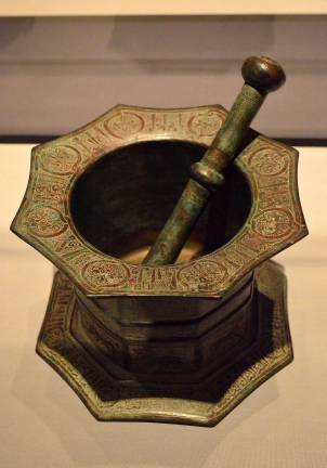 Calligraphic inscriptions decorate an early 13th century mortar and pestle from the ancient land of Khurasan. Photo: Adel Gorgy