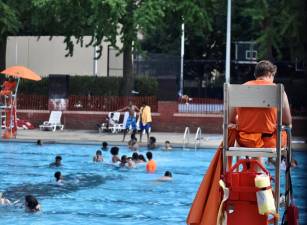 <b>Too few lifeguards have forced curtailment of youth Learn to Swim programs at most city pools and all adult lap swims have been cut. Hamilton Fish pool (above) boasts the only swimming lesson program for youngsters being offered at any city owned pool in Manhattan this summer. </b>Photo: Elijah Hurewitz-Ravitch