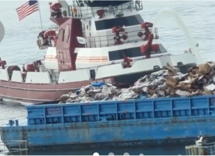 A fire on a sanitation barge at Pier 99 triggered a huge FDNY response. Fortunately, the barge was not occupied and there were no injuries reported.