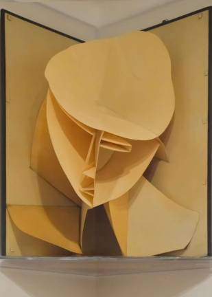 Naum Gabo's &#8220;Head of a Woman,&#8221; the ultimate pop-up page, peeks down at visitors. Photo by Adel Gorgy