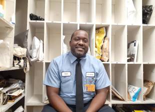 Jahdal Benjamin in the package room at The Andover in Yorkville. Photo: Karen Camela Watson