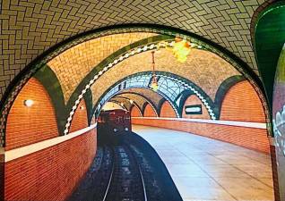 Don’t miss the train! From a Gustavo-tiled reproduction station to a Ric Burns documentary film about NYC’s transformation into a cultural and financial hub, it’s difficult to tell what is real and what is not in this picture. Photo: Ralph Spielman