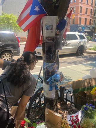 Heartbroken neighborhood residents add to a growing memorial on Amsterdam Ave. and W. 109th St. where two young fathers were killed by a drunk driver on the evening of May 15,.