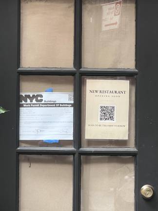 A new poster on the to-be entrance to the revived Café des Artistes encourages local residents to get on an email list for new updates.