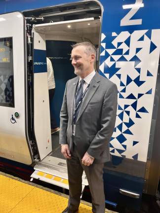 A smiling Roger Harris, president of Amtrak, poses against an open doorway with a broad smile. The realization of a nine-year dream, the NextGen Acela trains are finally running under Harris’s aegis. With luck and good maintenance, they will be delighting passengers for the new two generations.