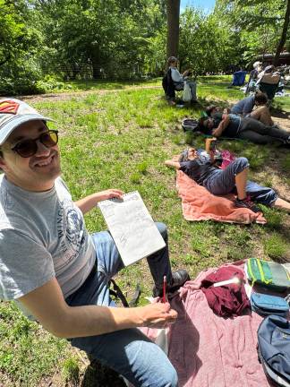 Dan Restrepo waiting in line sketching away. (Photo: Heather Stein)