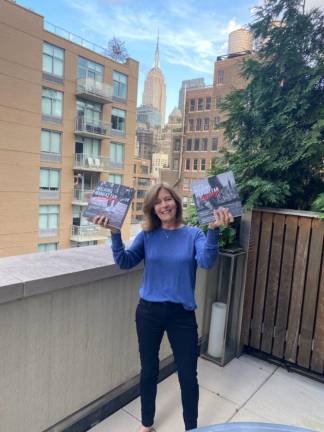 Betsy Bober Polivy with copies of her new book, “The Art of Walking Manhattan Sideways.” Photo courtesy of the author