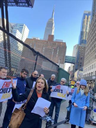 <b>Layla Law-Gisiko (front left) the chair of Community Board 5’s land use committee, joins Diana Gonzalez, (front row, right), e</b>xecutive director of New Yorkers for a Better Penn Plan--the organizer of a protest on Dec. 19 calling for Governor Kathy Hochul to come up with a new plan for the now vacant lot in Chelsea where the historic Hotel Pennsylvania once stood. Photo: Michael Oreskes