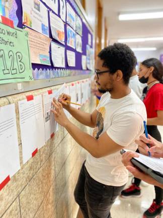 Students doing a gallery walk where stories were displayed. Photo courtesy of Ilana Gatoff