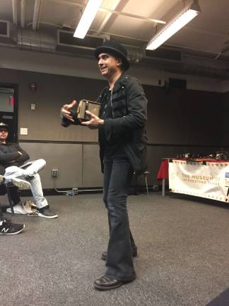 Denny Daniel demonstrating a camera obscura during a New York University lecture on the history of photography and film.