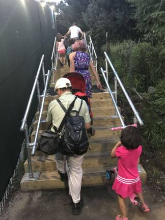 Ferry passengers clamber up the pitched slope at the northern end of Carl Schurz Park to get to and from the East 90th Street ferry landing on the East River, where a new riverboat route launched on Aug. 15. It's a pretty tough haul, and it is not ADA accessible. Photo: Douglas Feiden