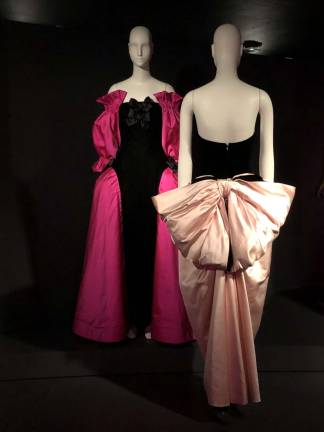 Victor Edelstein&#x2019;s black-velvet/pink-satin gown (1987) with giant bow suggests its wearer is a present. Photo: Val Castronovo