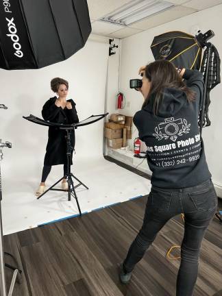 Ann Meshcheri at work in her Times Square studio. Photo: Courtesy Times Square Photo Studio