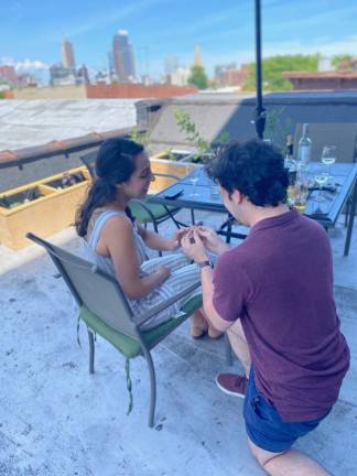 The proposal at a surprise engagement party in June 2020. Photo courtesy of Laura Santos-Bishop