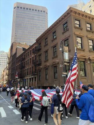Independence Day Parade marching down Pearl Street.