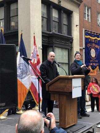 <b>Vinny Alvarez, president of the New York City Central Labor Council, calls on bystanders to remember the lessons learned at the Triangle Shirtwaist Factory fire 112 years ago as he speaks at the corner in Greenwich Village where the tragedy happened.</b> Photo: Keith J. Kelly