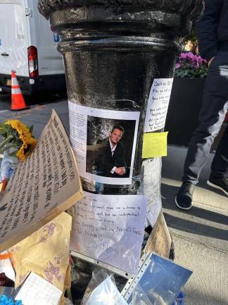 Notes that people have left on the street post for the late Matthew Perry outside the widely known apartment complex from the television series ‘Friends.’