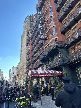 <b>Fire fighters leaving the scene of a fire inside the Chelsea Hotel on W, 23rd. St.</b>