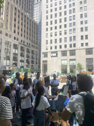 P.S. 180’s student choir was one of many groups of musicians gathered around a Sing for Hope piano to perform a collection of songs throughout the day. (Photo: Jacqueline Gordon)