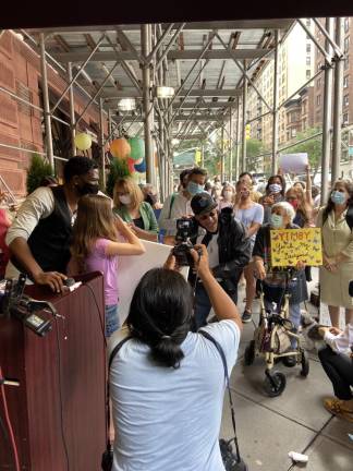 Elected officials and Upper West Siders with a resident of the Lucerne who said, “I really want to work.” Photo: Alexis Gelber