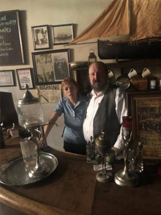 <b>Lorcan Otway and Genie Gilmore Otway, during their last days behind the bar at the William Barnacle Tavern that adjoined Theatre 80. The husband and wife owners were evicted from the bar, theater and the townhouse where they lived above the establishments by the real estate developers that took over the debt.</b> Photo: Keith J. Kelly