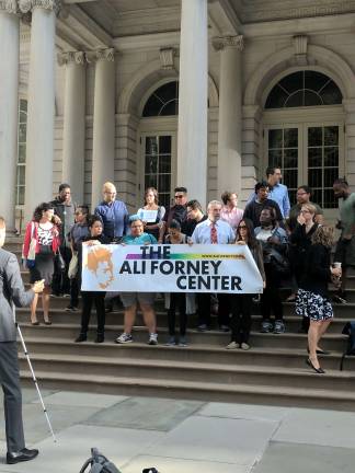 Youth and supporters from the Ali Forney Center gather on the steps of City Hall Thursday to advocate for the new legislation. Photo: Liz Hardaway