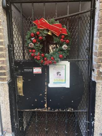 Masks required at a service entrance in the East 90s. Photo: Dody Tsiantar