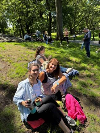 Maria Paz and her mom Patricia Veciño visiting from Argentina felt right at home in line. Enjoying their traditional South American drink Mate while waiting. (Photo: Heather Stein)