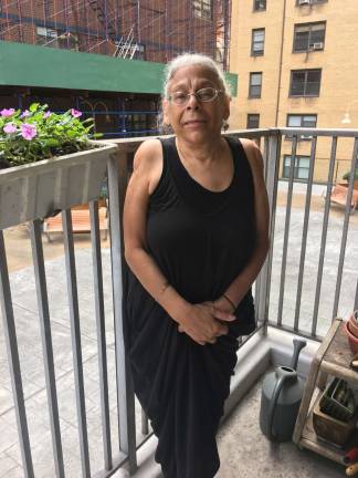 Sharon Canns, pictured on her balcony last fall after she was charged for repairs she says were never finished.&#xa0;She and several other tenant advocates attribute many rent-stabilized housing issues to lack of oversight by the DHCR. Photo: Madeleine Thompson