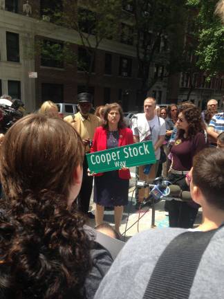 Councilmember Helen Rosenthal, holding sign, next to Cooper Stock's parents.
