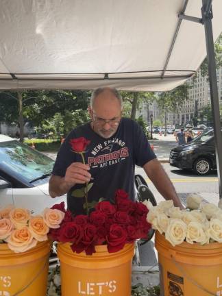 Flower vendor George Taxi near the entrance to the Manhattan Marriage Bureau. Photo: Shantila Lee