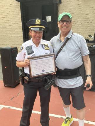 NYPD 24th Precinct Commanding Officer Noreen E. Lazarus (left) posing with the precinct’s Community Council rep. Neil Berson.