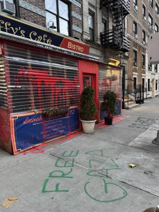 The outside of popular Jewish owned, Effy’s Cafe, located at 104 W 96th street in the Upper West Side, vandalized by fake blood over the restaurant shed and “Free Gaza” spray painted in graffiti on March 18. Photo Credit: Ben Zara, manager of Effy’s Cafe.
