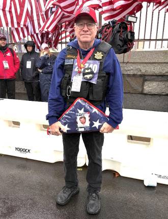 John Herold, brother of 9/11 victim Gary Herold, whose photo he’ll carry with him along with a folded flag through the Battery Tunnel.