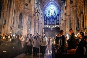 Mayor Eric Adams (third from right) attends Midnight Mass on Christmas Eve at St. Patrick’s Cathedral on Saturday, December 24, 2022. Photo: Diane Bondareff/Mayoral Photography Office