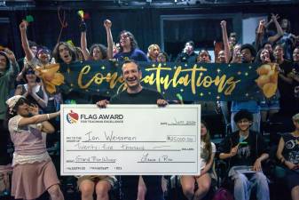Ian Weissman, a social studies teacher at Repertory Company High School for Theatre Arts, receives the FLAG Award for Teaching Excellence. Beginning June 8, six exceptional New York City public school teachers received surprise $25,000 checks for winning FLAG Awards for Teaching Excellence.