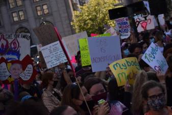 When the marching began, thousands filled the streets. Some men came in solidarity with the women in their lives. Photo: Leah Foreman