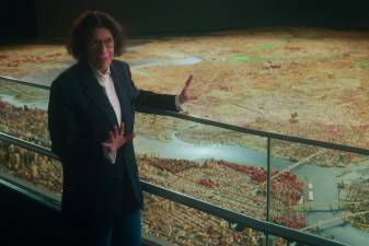 Fran Lebowitz by a 3-D model of New York, located inside The Queens Museum in Flushing Meadows-Corona Park. Photo courtesy of Netflix