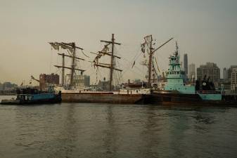 The Cuauhtémoc being towed June 6. It suffered damage resulting in the death of two Mexican naval cadets when it crashed into the Brooklyn Bridge on May 17.