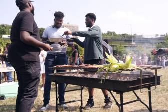 Friends barbequing for the celebration of Juneteenth at As Black As It Gets!. Photo: Beau Matic