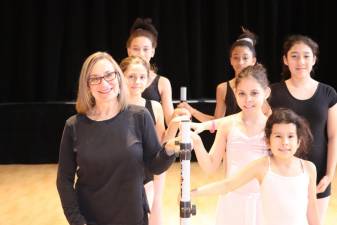 Susan Mac Macaluso with young artists in a ballet class at the Bernie Wohl Center.