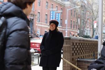 Headmaster Kim Smith greets students as they arrive for classes at Xavier High School in Chelsea. Photo courtesy of Xavier High School