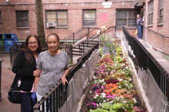 Delfena Plasencea and Maria Moneira in front of their Chelsea-Elliot apartment on 10th Avenue and 26th Street. Photo: Beau Matic.