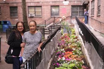 Delfena Plasencea and Maria Moneira in front of their Chelsea-Elliot apartment on 10th Avenue and 26th Street. Photo: Beau Matic.