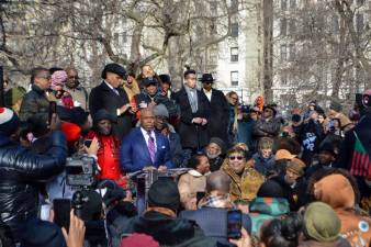 Mayor Eric Adams (at podium) and NYS Senator Cordell Cleare (left) delivered remarks. Photo: Abigail Gruskin