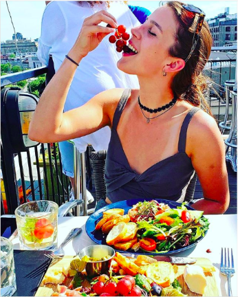 This young woman has the right idea: Grapes make a nutritious snack.