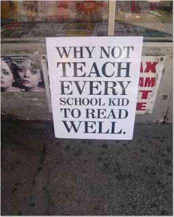 Bill Gunlocke carries this sign every morning to the Chambers Street headquarters of New York's schools chancellor
